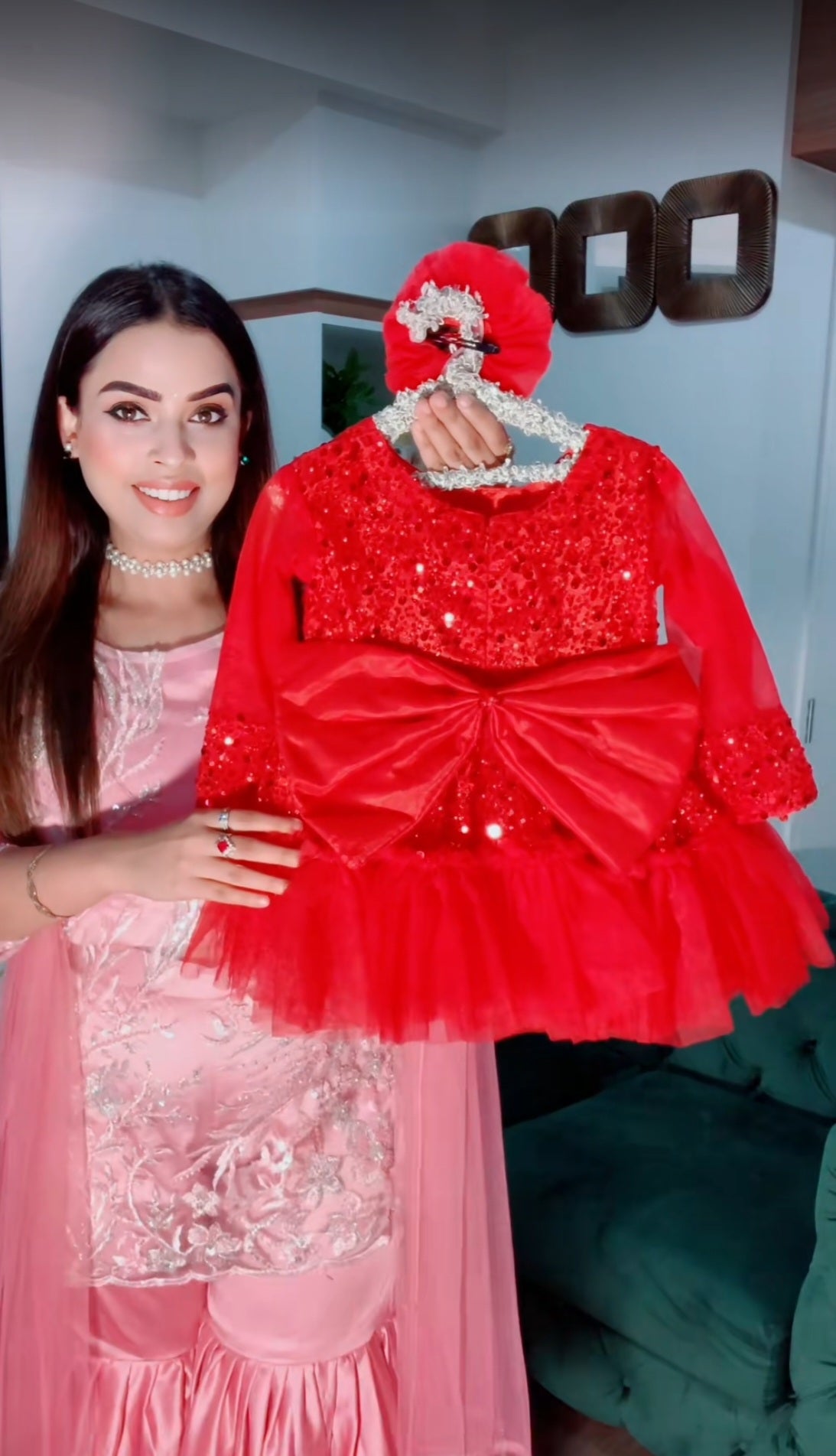 Red colour sequin frock with big bow and hair accessory